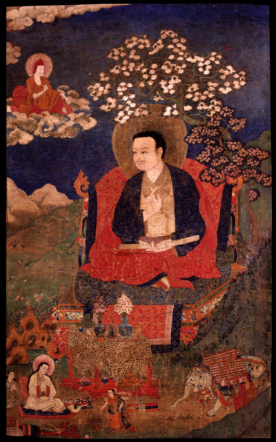 Figure seated on throne underneath blossoming tree branches, above miniature scene, before mountainous landscape