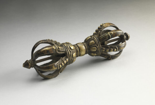 Religious implement in vajra shape: two open spheres formed by curved prongs connected by shaft