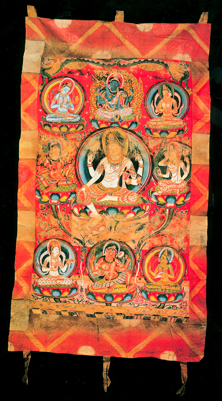 Rectangular textile depicting seated Bodhisattva surrounded by eight smaller deities against background of red and gold