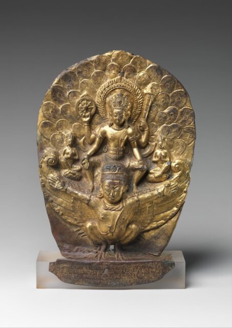 Ovoid relief sculpture depicting deity riding Garuda (divine creature with human head/torso and bird wings/legs)