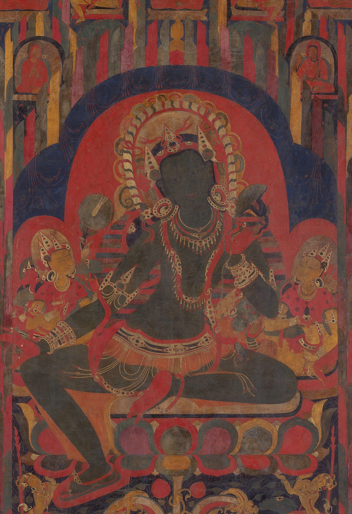 Close view of green-skinned Bodhisattva flanked by crowned deities, enclosed in red and blue nimbus