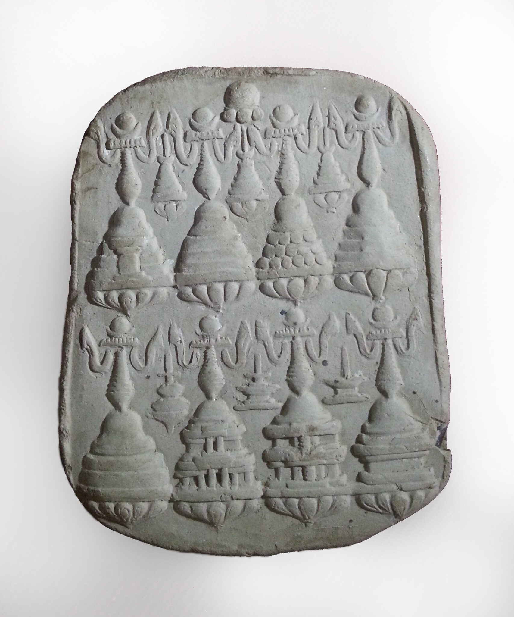 Molded relief featuring two rows of four stupas, each with different patterns around bases