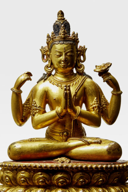 Gilded bodhisattva seated on lotus base with two hands clasped at chest, two hands raised at sides