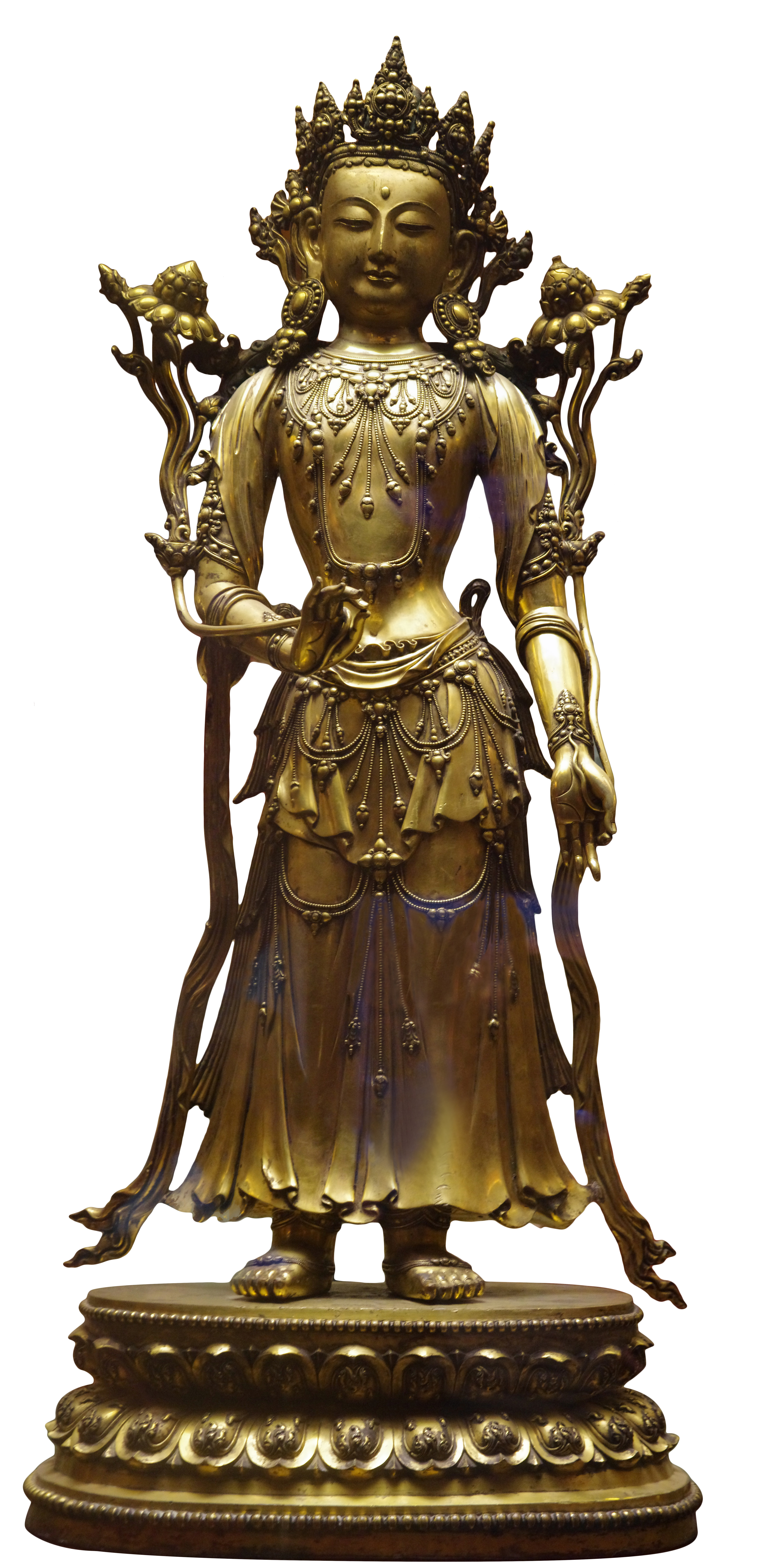 Gilded statue depicting Bodhisattva wearing flowing skirt and elaborate accessories standing between two long-stemmed blossoms