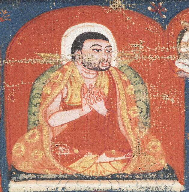 Close view of saffron-robed figure seated with hands posed in mudras before orange nimbus