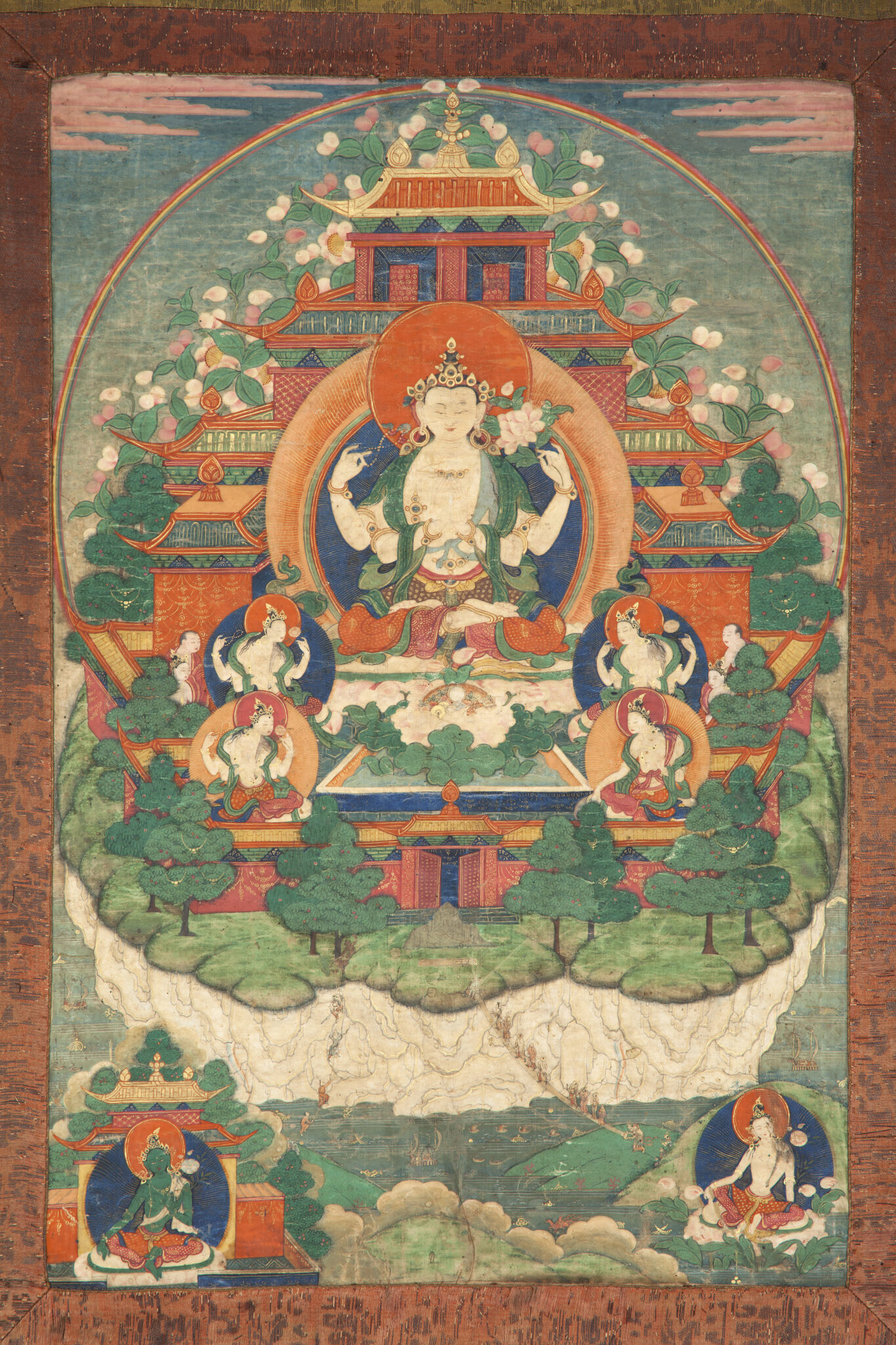 Bodhisattva flanked by attendants seated before pagoda-roofed structure emerging from forested white-stone mound