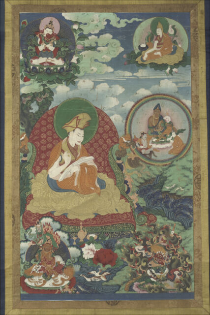Lama seated on throne upholstered with red-and-gold brocade above two wrathful deities beneath three portraits