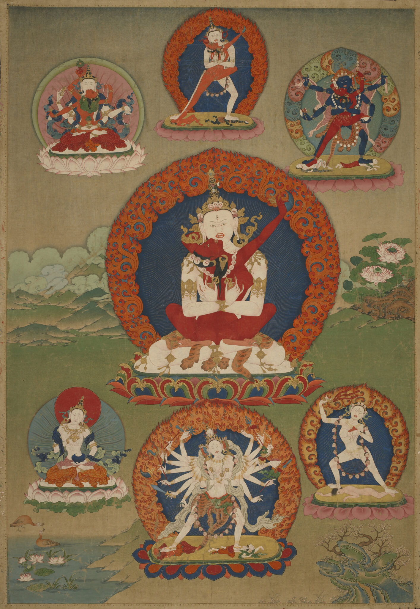 Wrathful deity locked in embrace with consort above mountain landscape surrounded by six deity portraits
