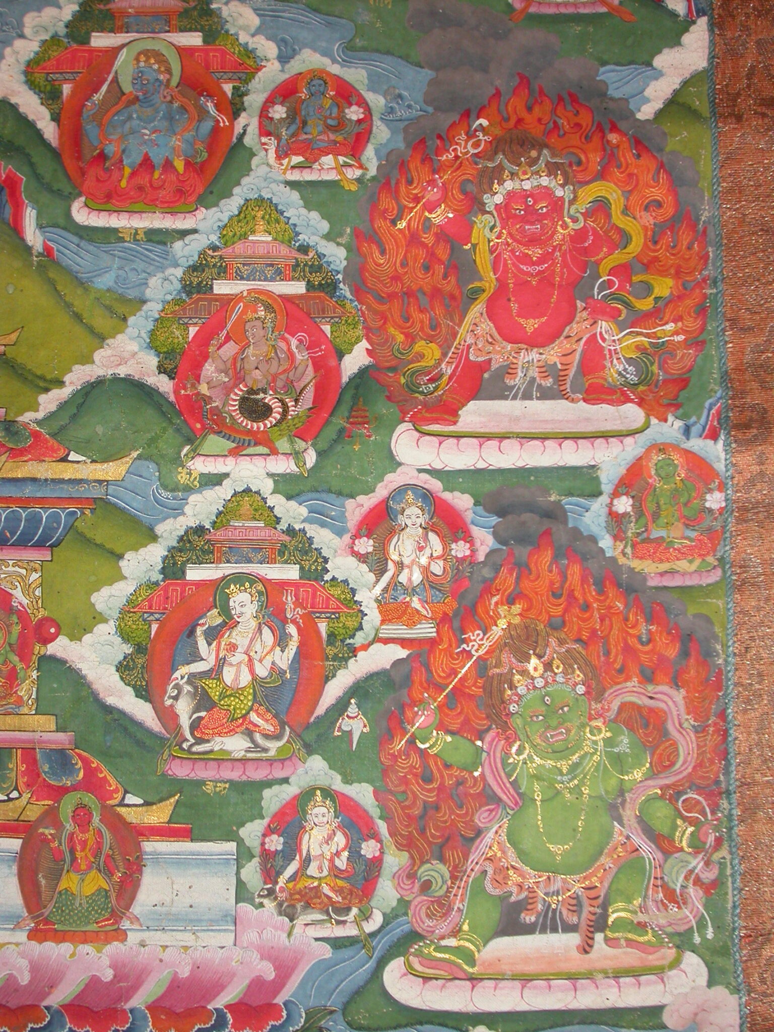 Portraits depicting red- and green-skinned wrathful deities with fiery nimbuses and eight planetary deities