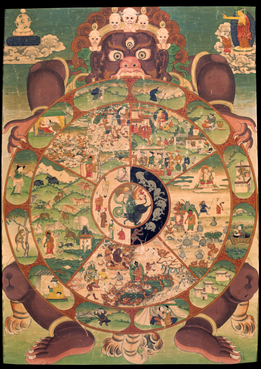 Wrathful deity holds wheel decorated with five main scenes and multitude of smaller scenes and portraits