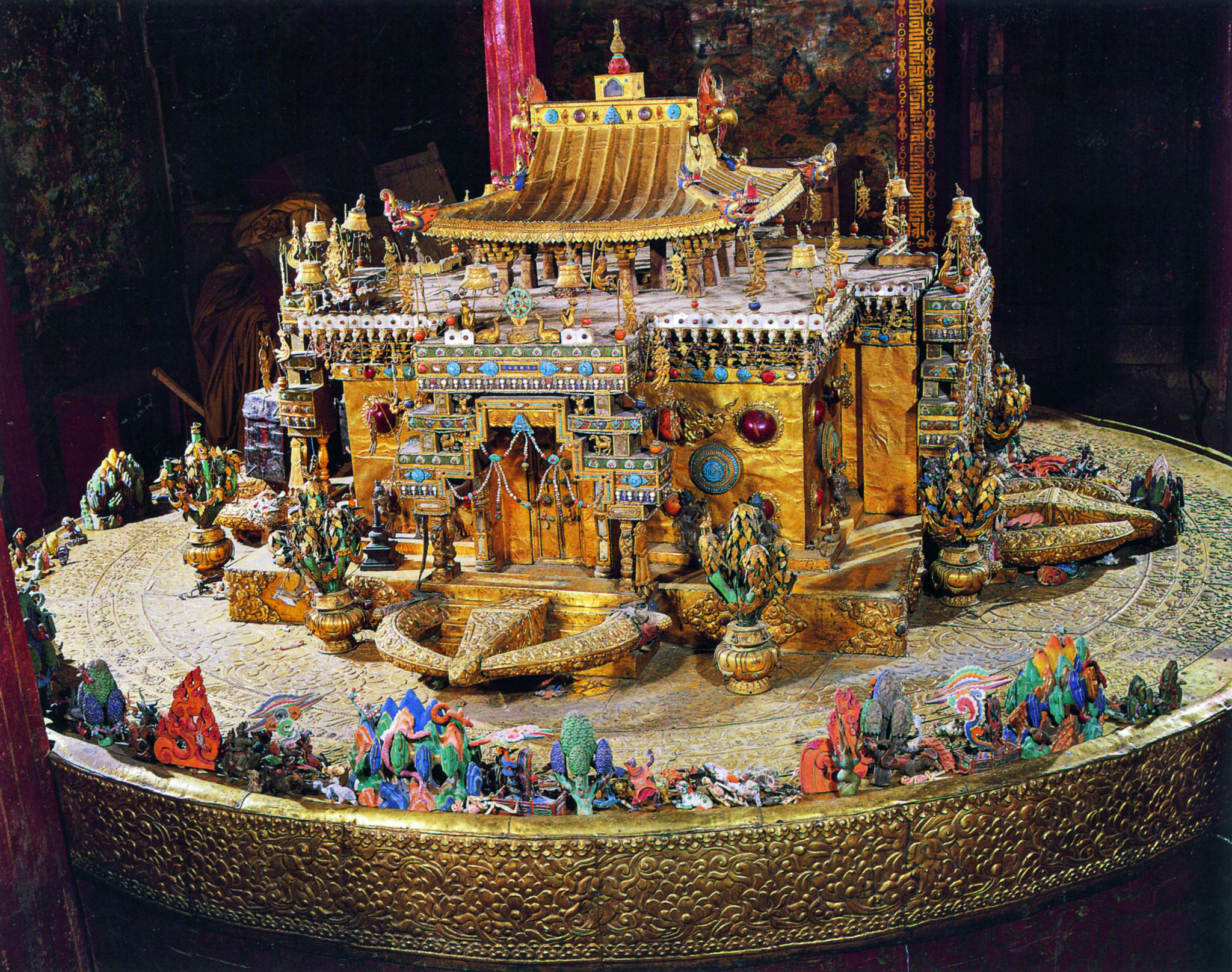 Three-dimensional mandala in the form of golden pagoda-roofed palace decorated with colorful inset stones