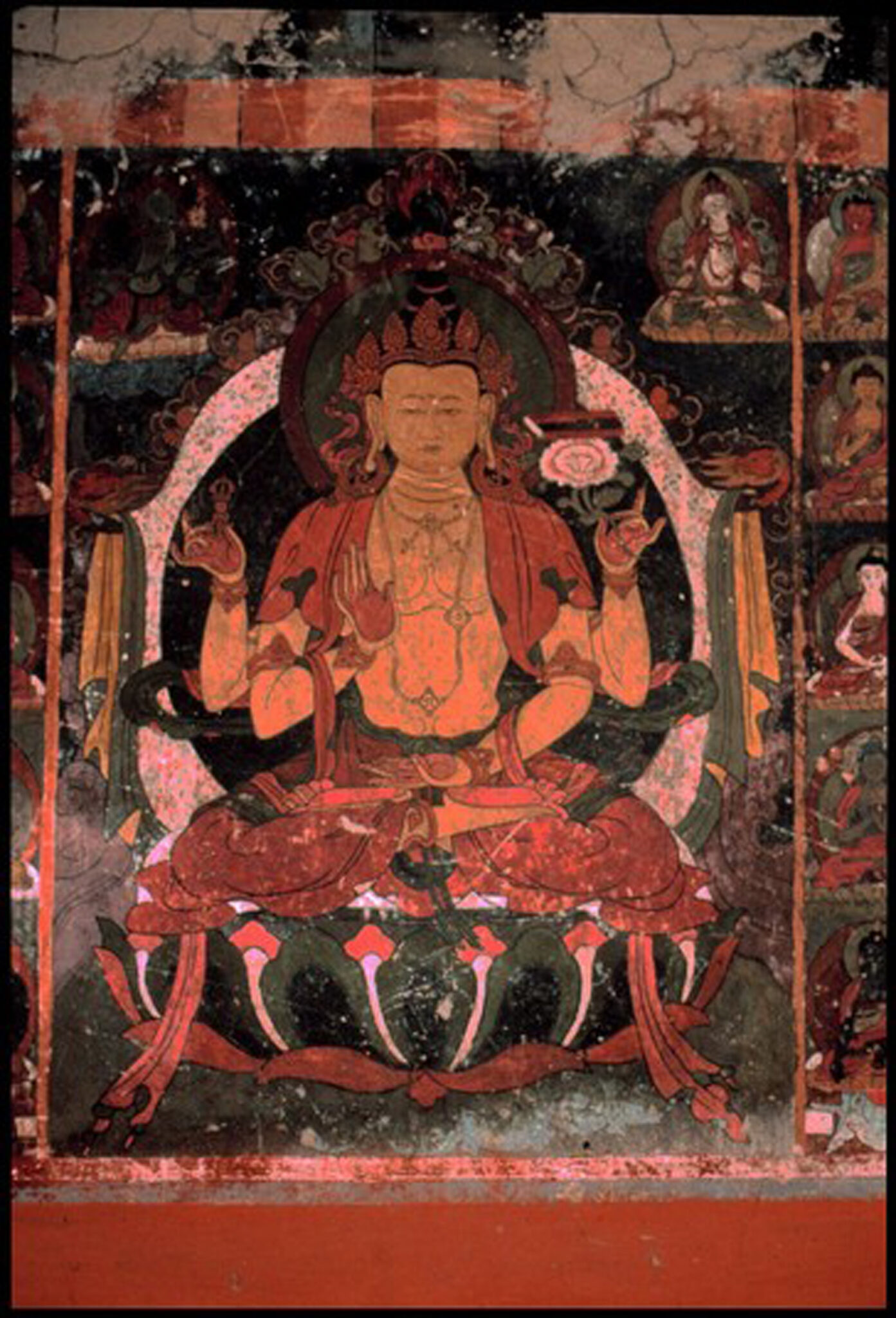Mural depicting four-armed Bodhisattva: two hands posed in mudras, two hands hold symbolic implements