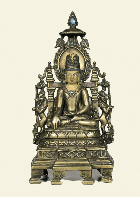 Bronze statuette of enthroned Buddha decorated with patterns, two animals in profile, and turquoise stones