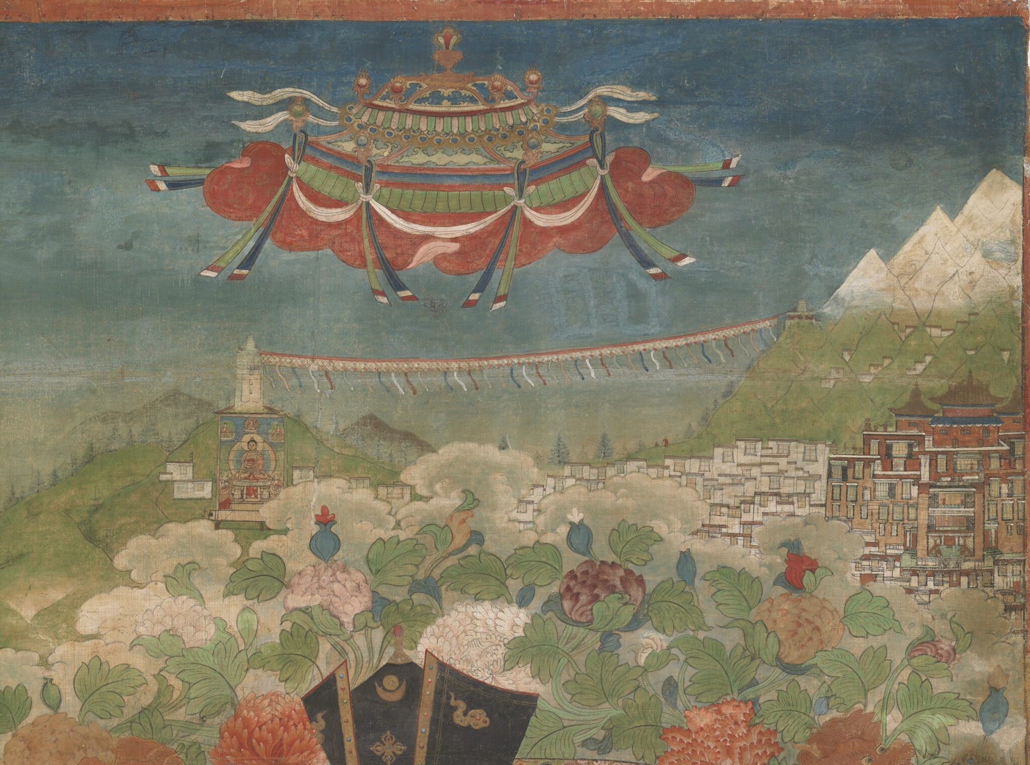 Detail of painting featuring disc-shaped object adorned with fluttering textiles hovering above mountains and monastery