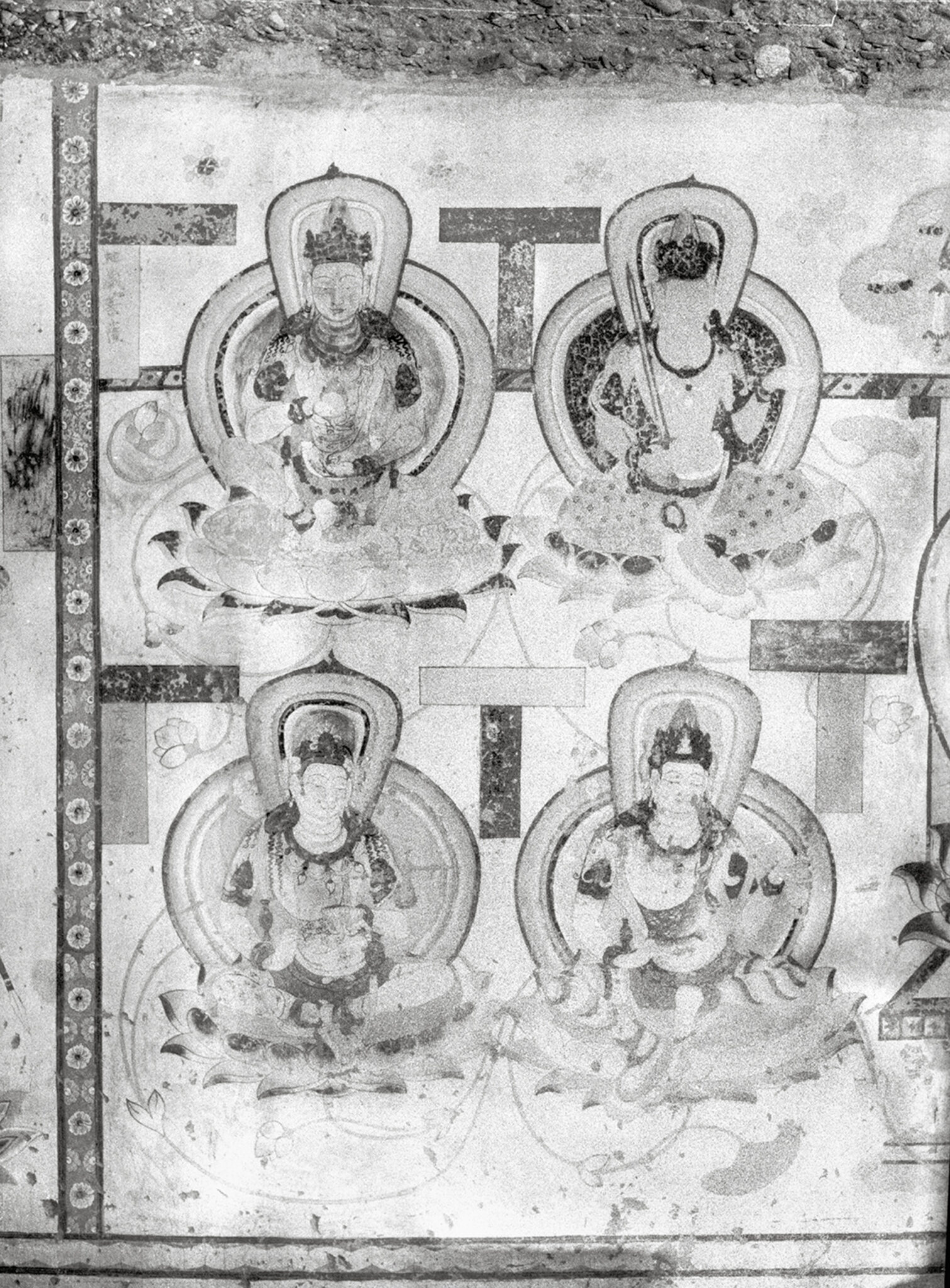 Black and white image of wall painting depicting four haloed deities seated on lotus pedestals