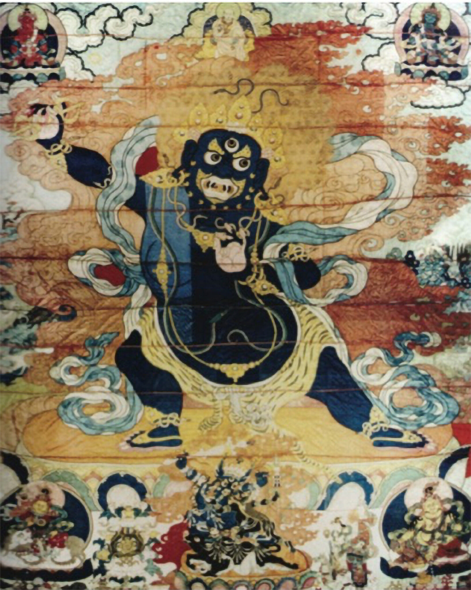 Wrathful deity wearing tiger pelt at waist stands with vajra held in raised left arm