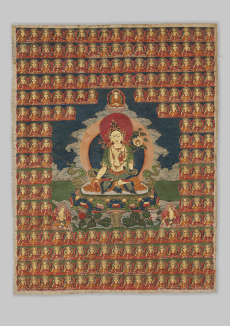 Bodhisattva holding long-stemmed blossom sits before landscape surrounded by dozens of portraits in grid arrangement