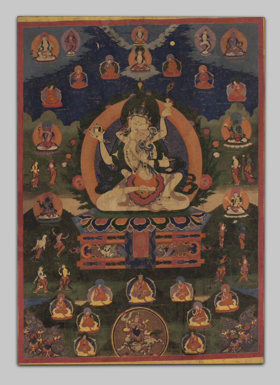Deity and consort locked in embrace, holding spiritual implements, surrounded by deity portraits